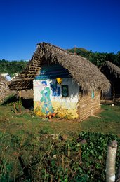Comoros-Archipelago;-France;-Housing;-Hut;-Indian-Ocean;-Kaleidos;-Kaleidos-images;-La-parole-à-limage;-Laurent-Abad;-Mayotte;-Mud-wall;-Mural;-Stories-Pictures;-Thatched-roof;-Village